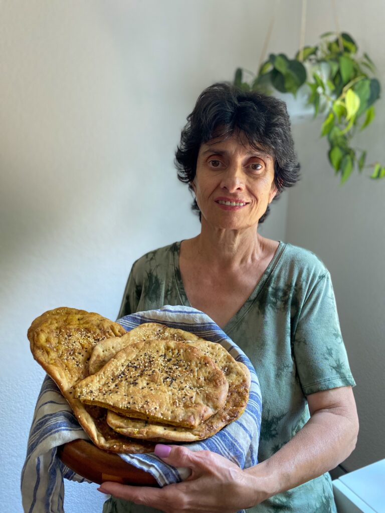 woman holding persian bread